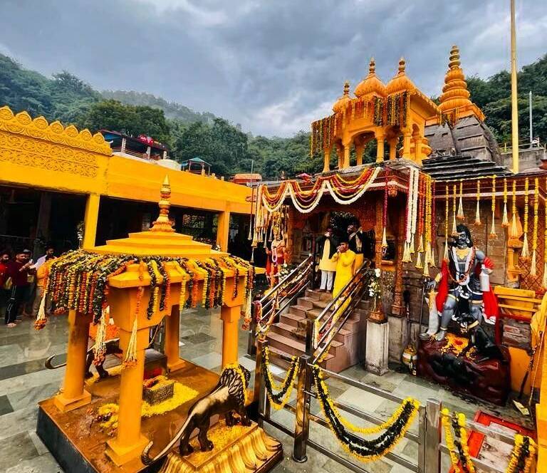 A captivating image showcasing the architectural grandeur of Baglamukhi Temple in Kangra, nestled amidst the serene landscape of the Himalayas, emanating a sacred aura of devotion and spirituality.