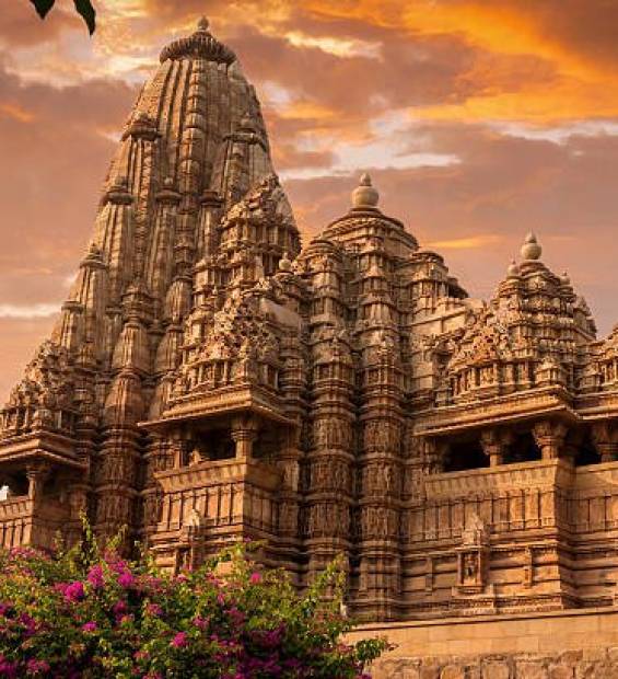 "A serene silhouette of a temple against the backdrop of a stunning sunset in India, showcasing the tranquil beauty and spiritual essence of this sacred place